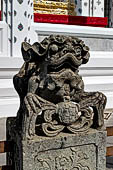 Bangkok Wat Arun - chinese lion of the precint of the sacred area of the ubosot.